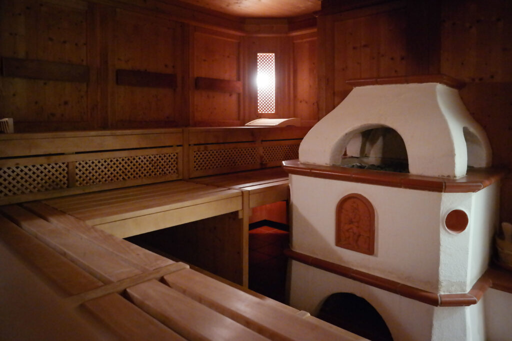 Home sauna assembly with traditional and infrared sauna setup in a modern home interior